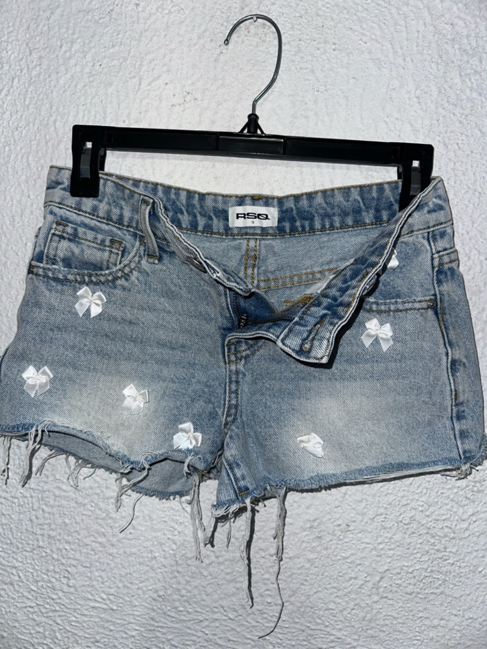 RSQ Light Blue Distressed Denim Shorts with White Bow Accents